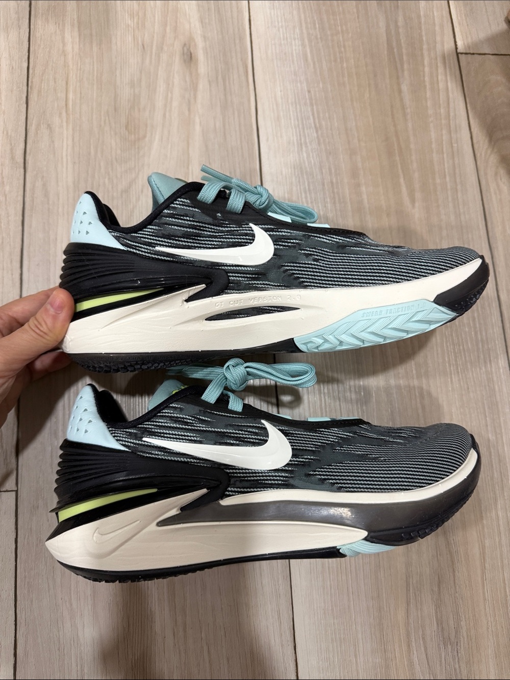 Nike Black Running Shoes with White Swoosh and Light Teal Accents